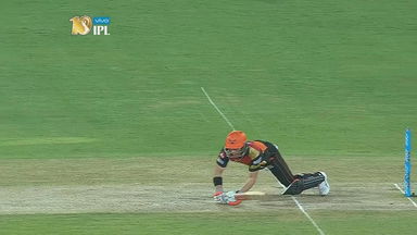 WIDE - and Warner tumbles on the pitch full stretch