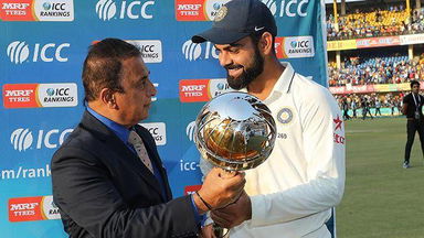 Virat Kohli receives the Test mace