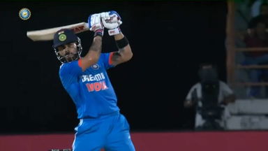 Smashed: Kohli smacks powerful six down the ground off Starc