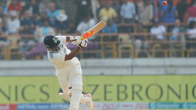Smashed! Sarfaraz' powerful strike down the ground for his first six in Test cricket