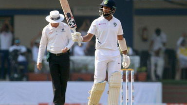 Pujara's stroke-filled half century