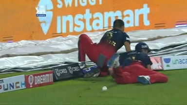 OUCH: Lomror crashes into Harshal Patel's ribs trying to save a boundary