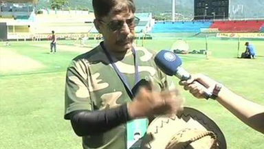 Sunil Chauhan shows off his autographed hat