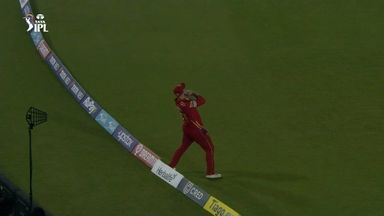 A step too far: Livingstone takes the catch but touches the ropes